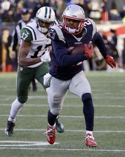 New England Patriots cornerback Malcolm Butler (21) runs with the ball after intercepting a pass intended for New York Jets wide receiver Charone Peake (17) during the second half of an NFL football game, Saturday, Dec. 24, 2016, in Foxborough, Mass. (AP Photo/Elise Amendola)