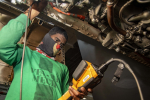 Military Spotlight: Newport News Sailor Inspects Engine on Aircraft Aboard U.S. Navy Warship