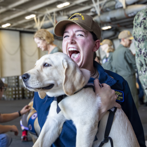 Service Dogs Visit Navy Sailors Aboard USS George H.W. Bush to Aid in Stress Relief Ahead of Deployment