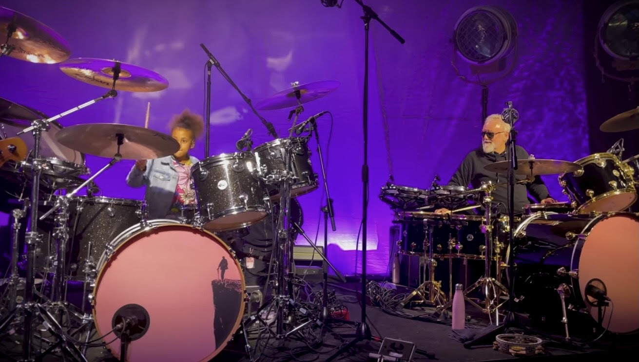 Watch Child Star Nandi Bushell Engage In A Drum Off With Roger Taylor