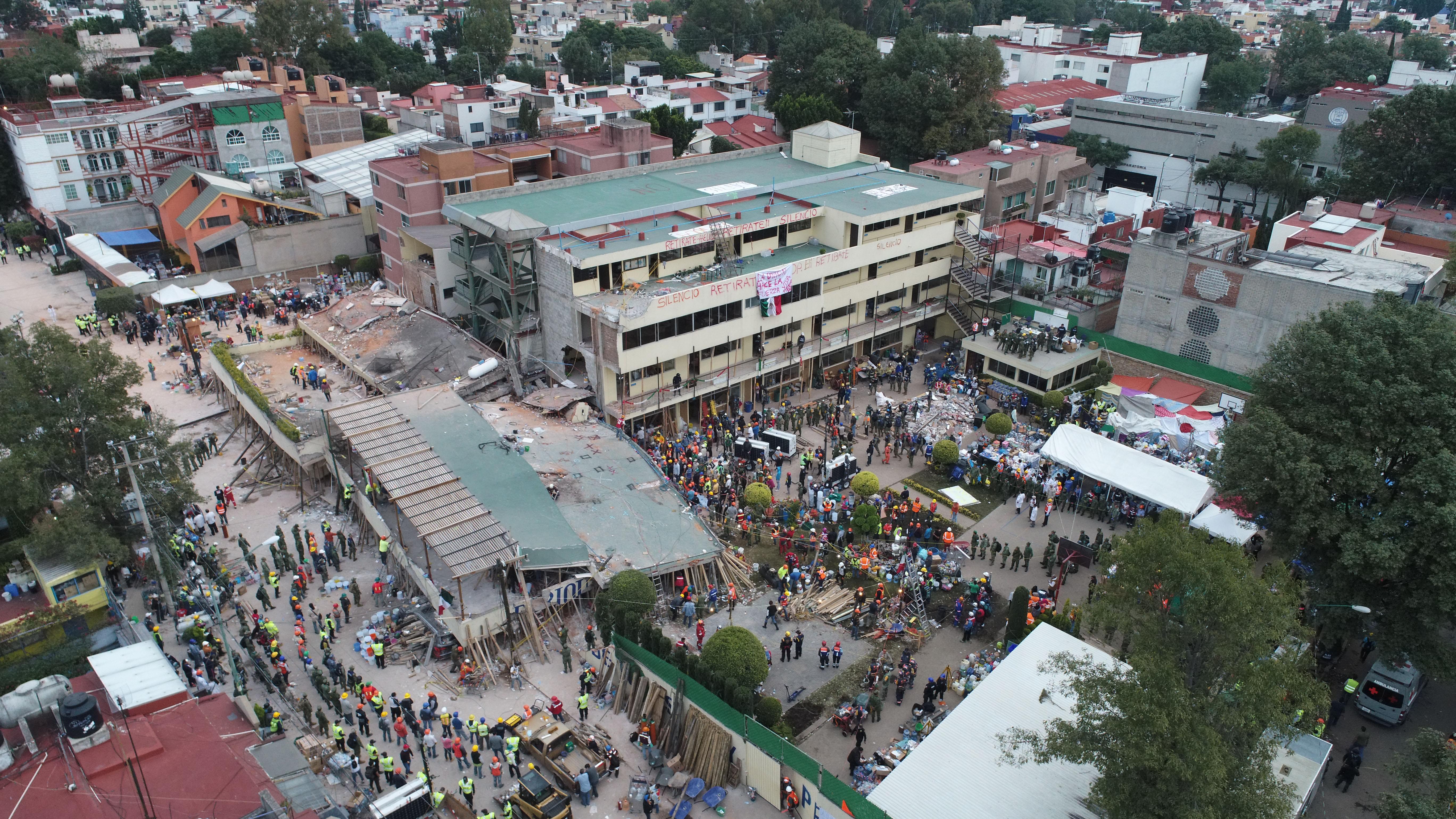 Mexico Earthquake: Rescuers Attempt To Reach Girl Trapped Under Collapsed School