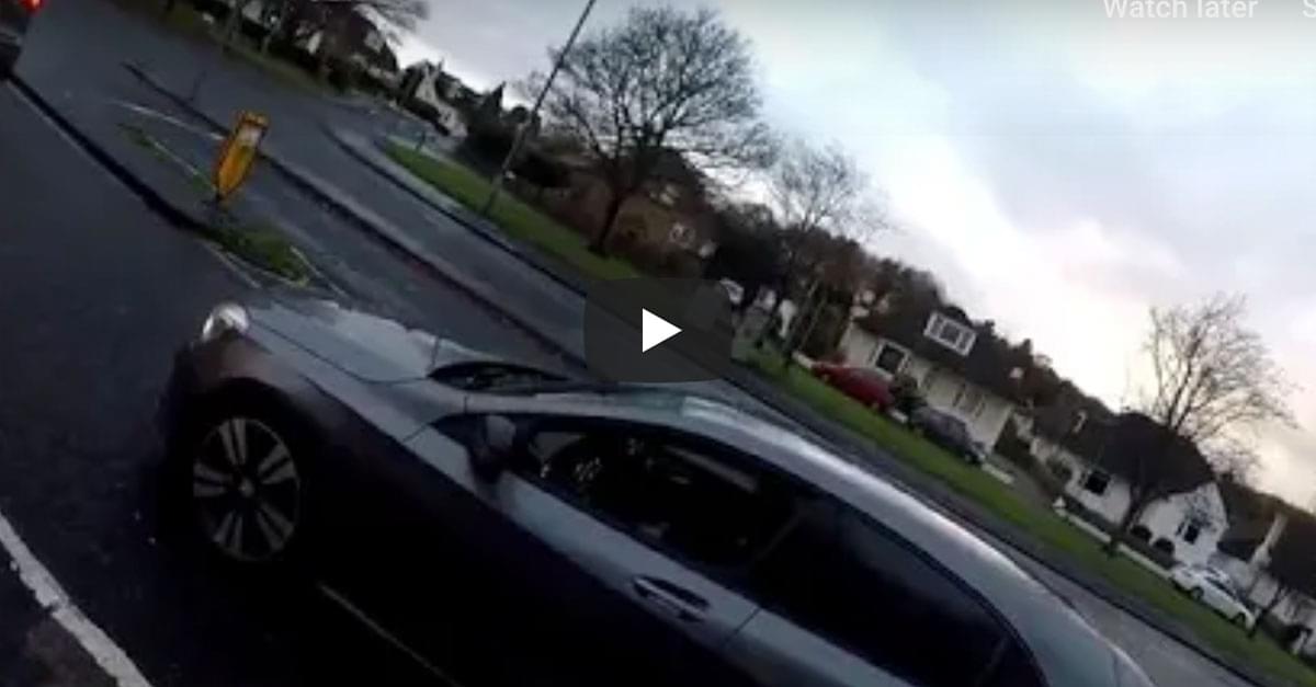Watch: Motorist Hits Car Moments After Telling Cyclist He Can Use Cellphone Safely