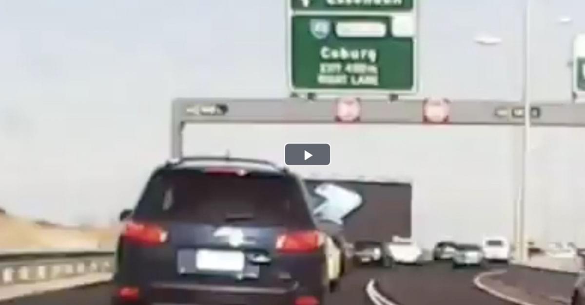 Watch: Large Freeway Sign Falls on Moving Vehicle