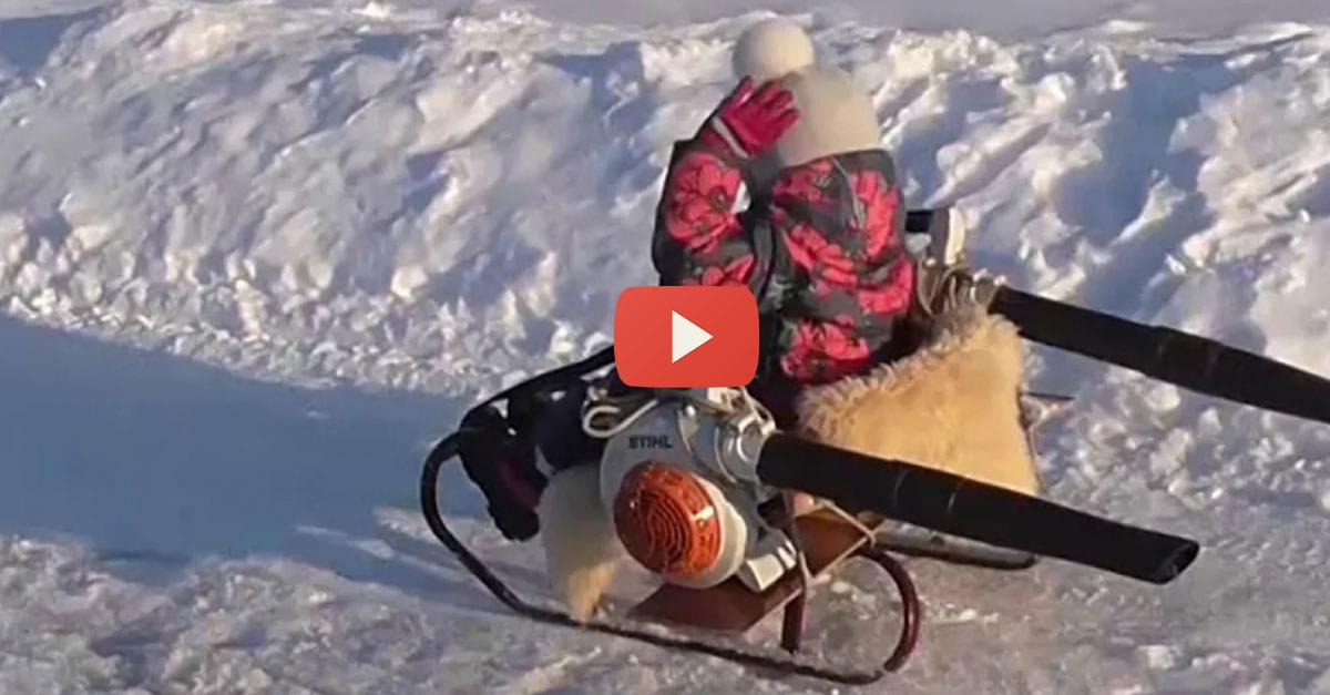 Watch: Dad creates snowmobile from a sled and leaf blowers