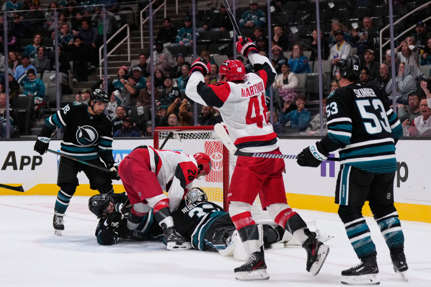Carrier, Robinson score late in 2nd period and Hurricanes beat Sharks 5-1 to improve to 3-0