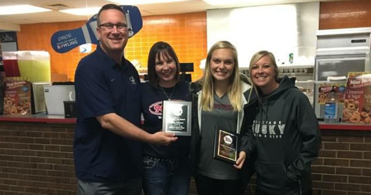 Bailey from Heritage High gets her plaque for Athlete of the Month!
