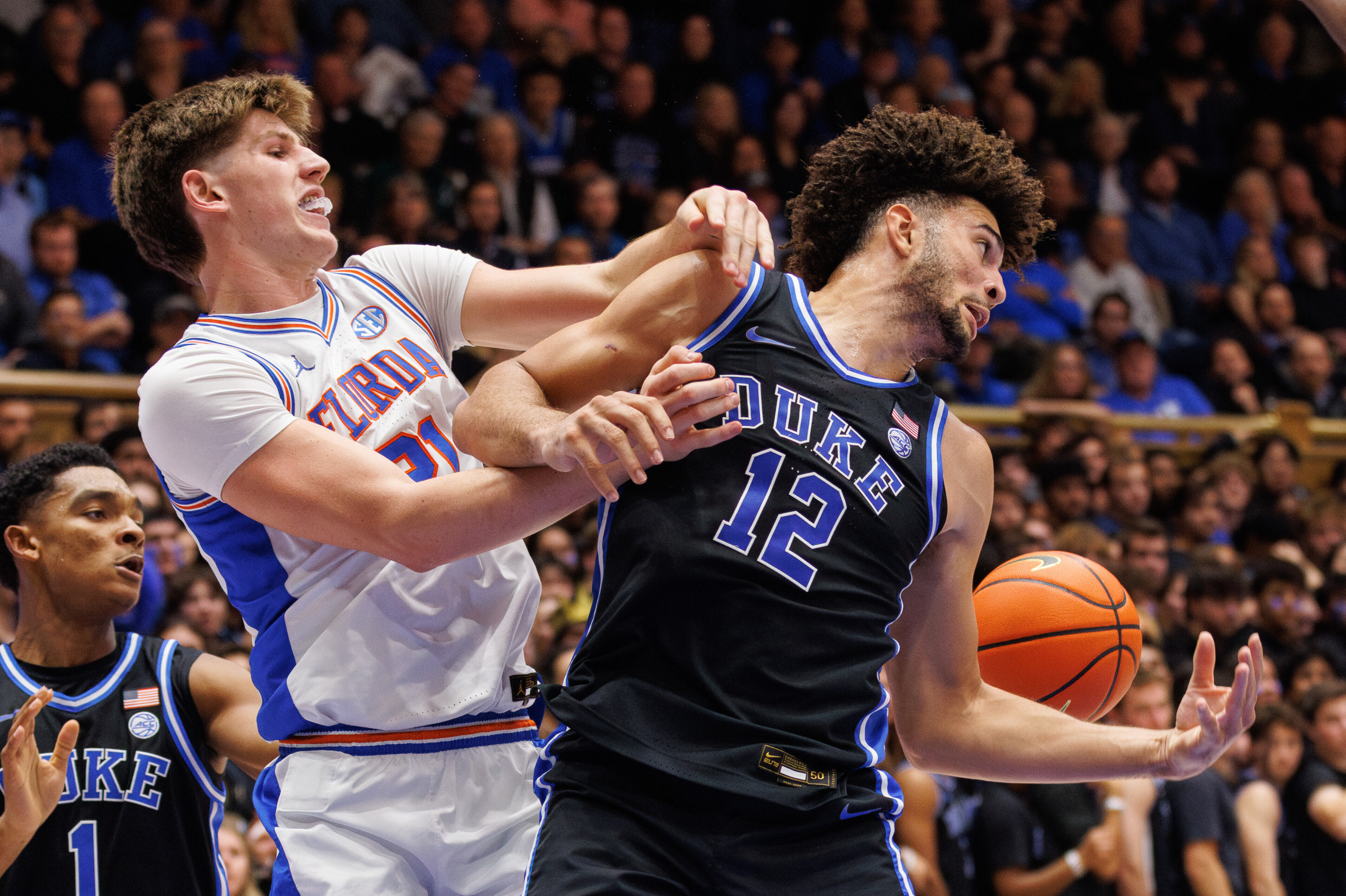 Evans’ late 3 helps No. 4 Duke top No. 15 Florida 67-66 in ACC/SEC Challenge