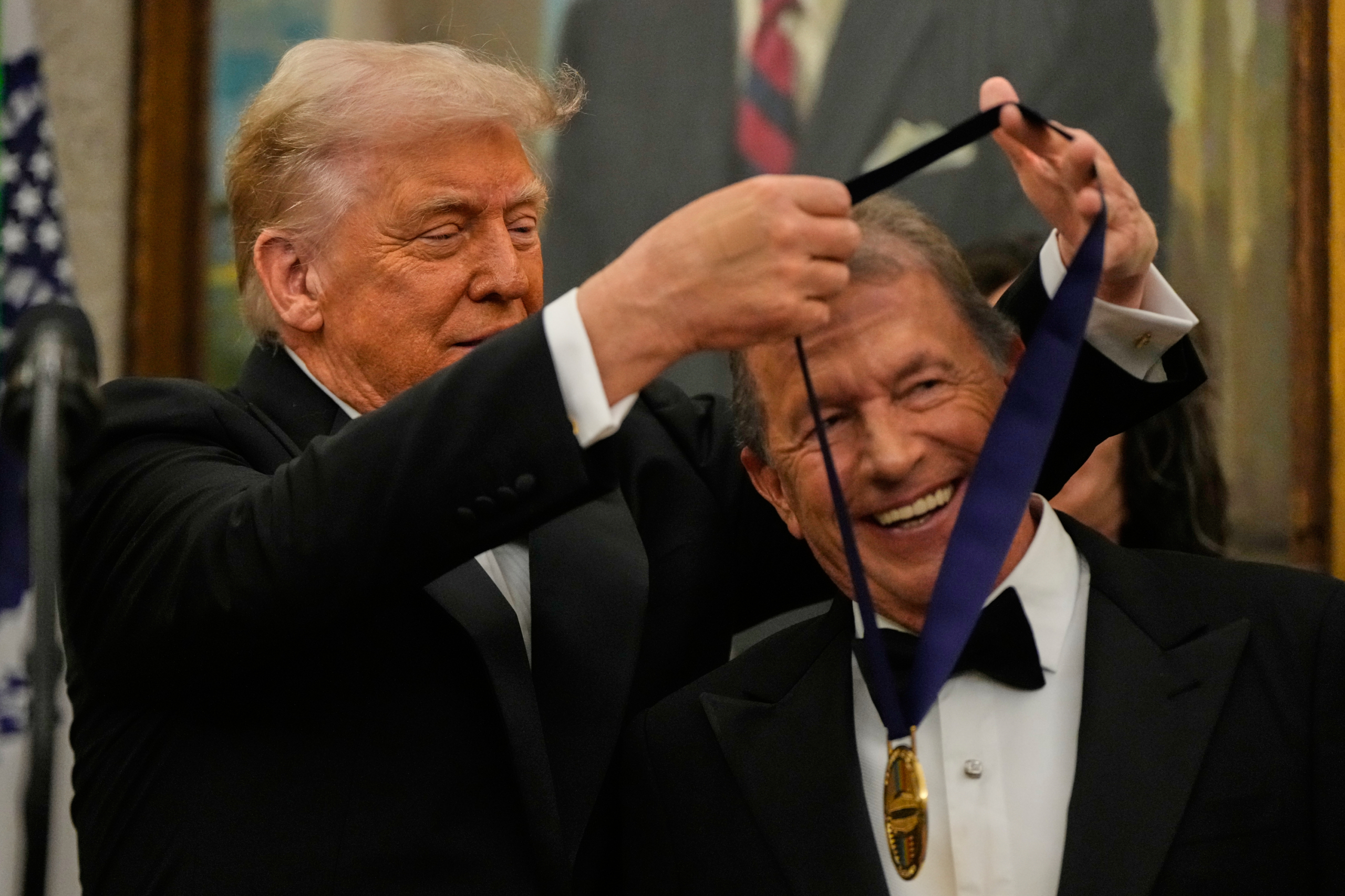 Trump awards medals to the Kennedy Center honorees in an Oval Office ceremony
