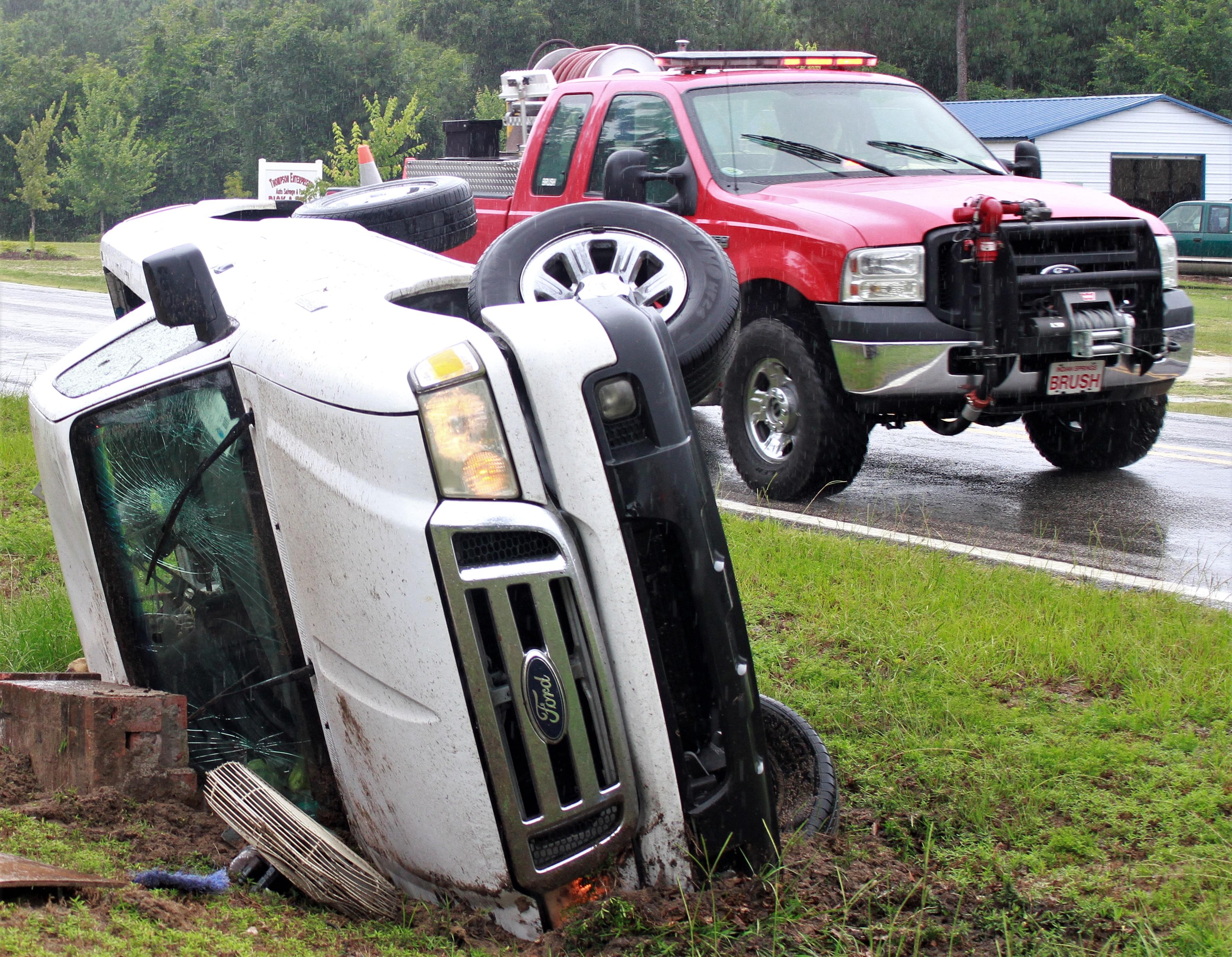 Vehicle Overturns In Front Of EMS Station (PHOTOS)