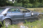 Vehicle Rolls, Lands In Field (PHOTOS)