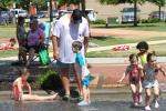 Children Enjoy Sprinkler Days Downtown