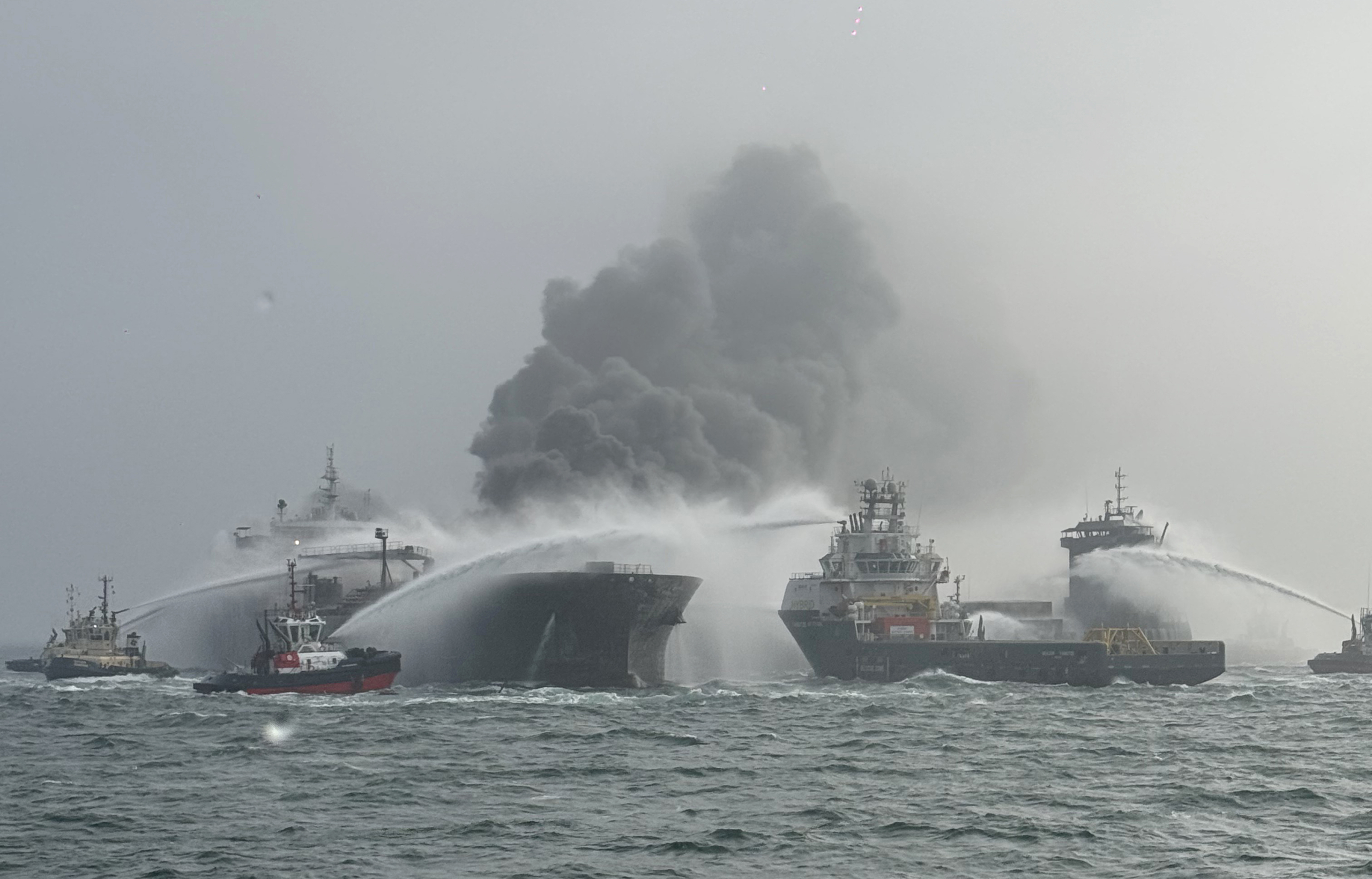 A cargo ship hits a tanker and they catch fire off England, with one crew member missing