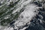 Hurricane Erin leaves rough seas with 2 swimmers dead and a search underway for a missing boater
