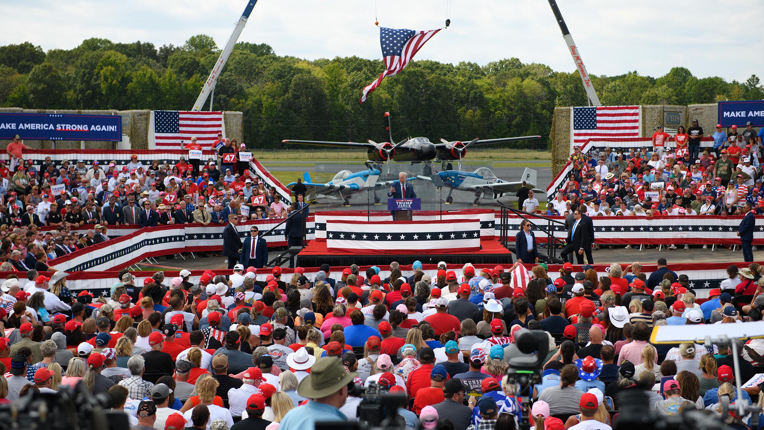 Trump speaks from behind bulletproof glass at first outdoor rally since his attempted assassination