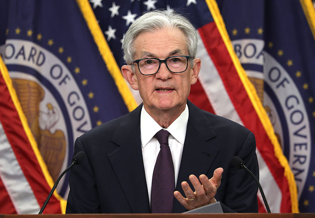 Fed leaves key rate unchanged as it awaits the impact of tariffs and Trump again scolds Powell