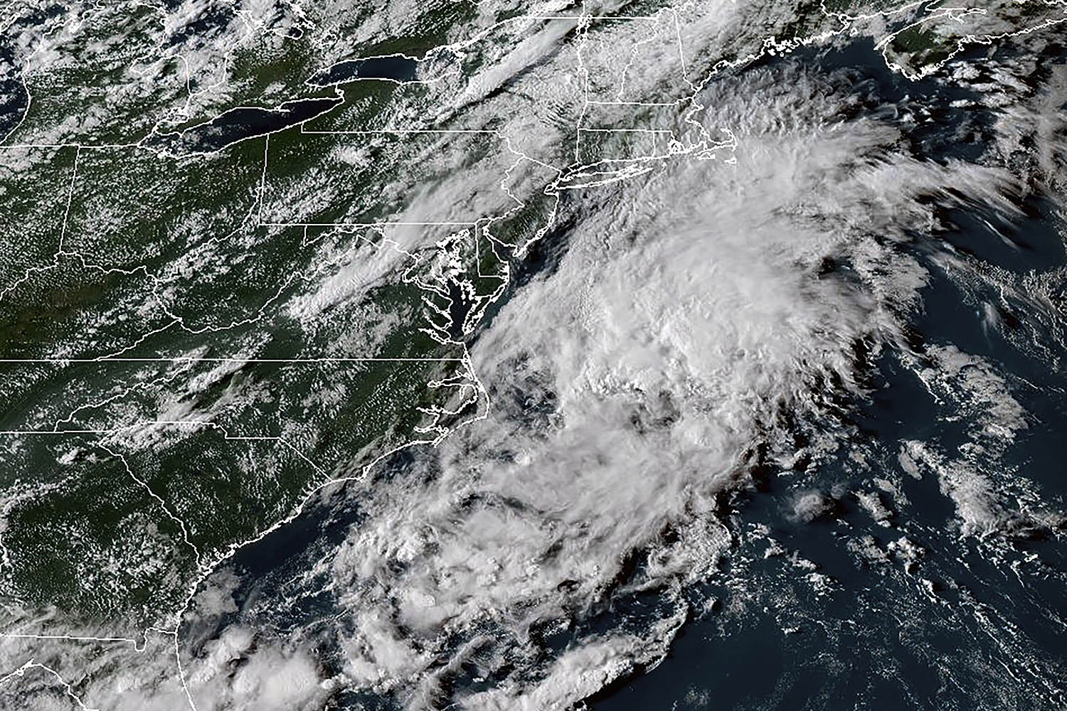 Hurricane Erin leaves rough seas with 2 swimmers dead and a search underway for a missing boater