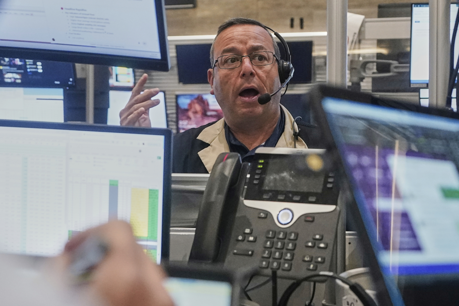 Stocks pull back from their latest all-time highs on Wall Street