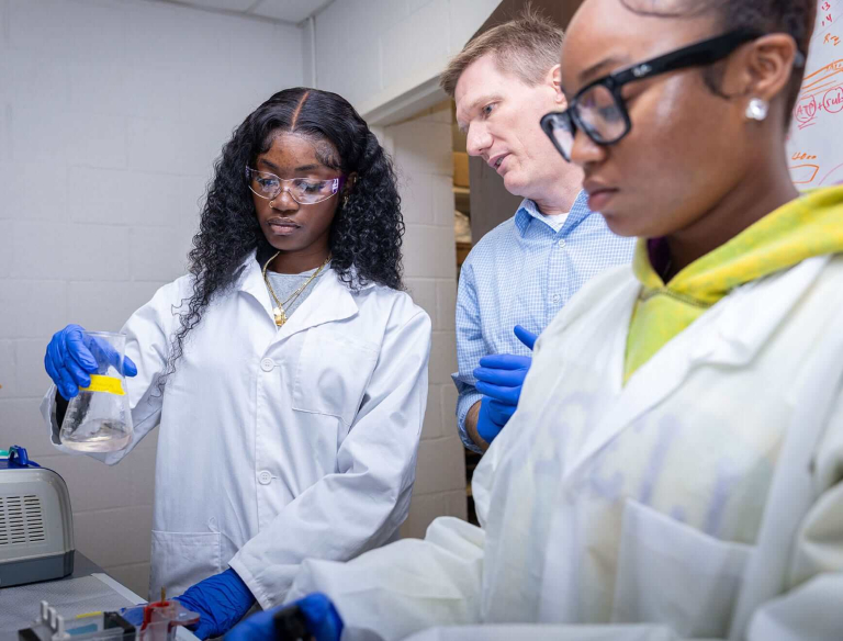 Robert Newman, Ph.D., Nathan F. Simms Distinguished Professor in the Department of Biology at North Carolina Agricultural and Technical State University, works with student researchers in his biology lab on campus.