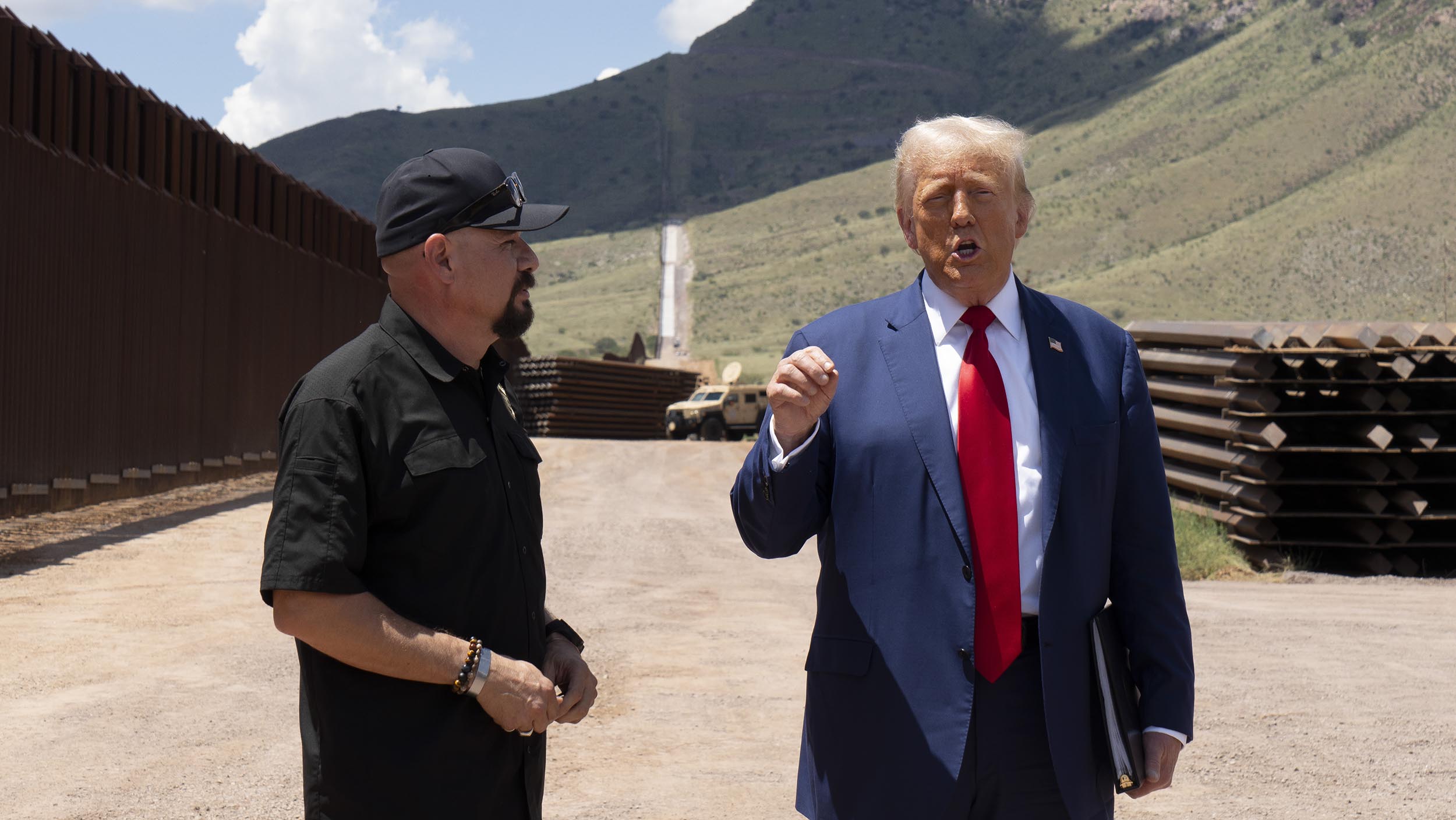 Trump uses a stretch of border wall and a pile of steel beams in Arizona to contrast with Democrats