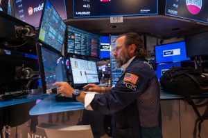 Wall Street hangs near its record as PepsiCo and United Airlines fly and health care stocks sink