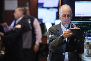 A late push sends Wall Street near its records