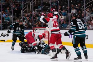 Carrier, Robinson score late in 2nd period and Hurricanes beat Sharks 5-1 to improve to 3-0