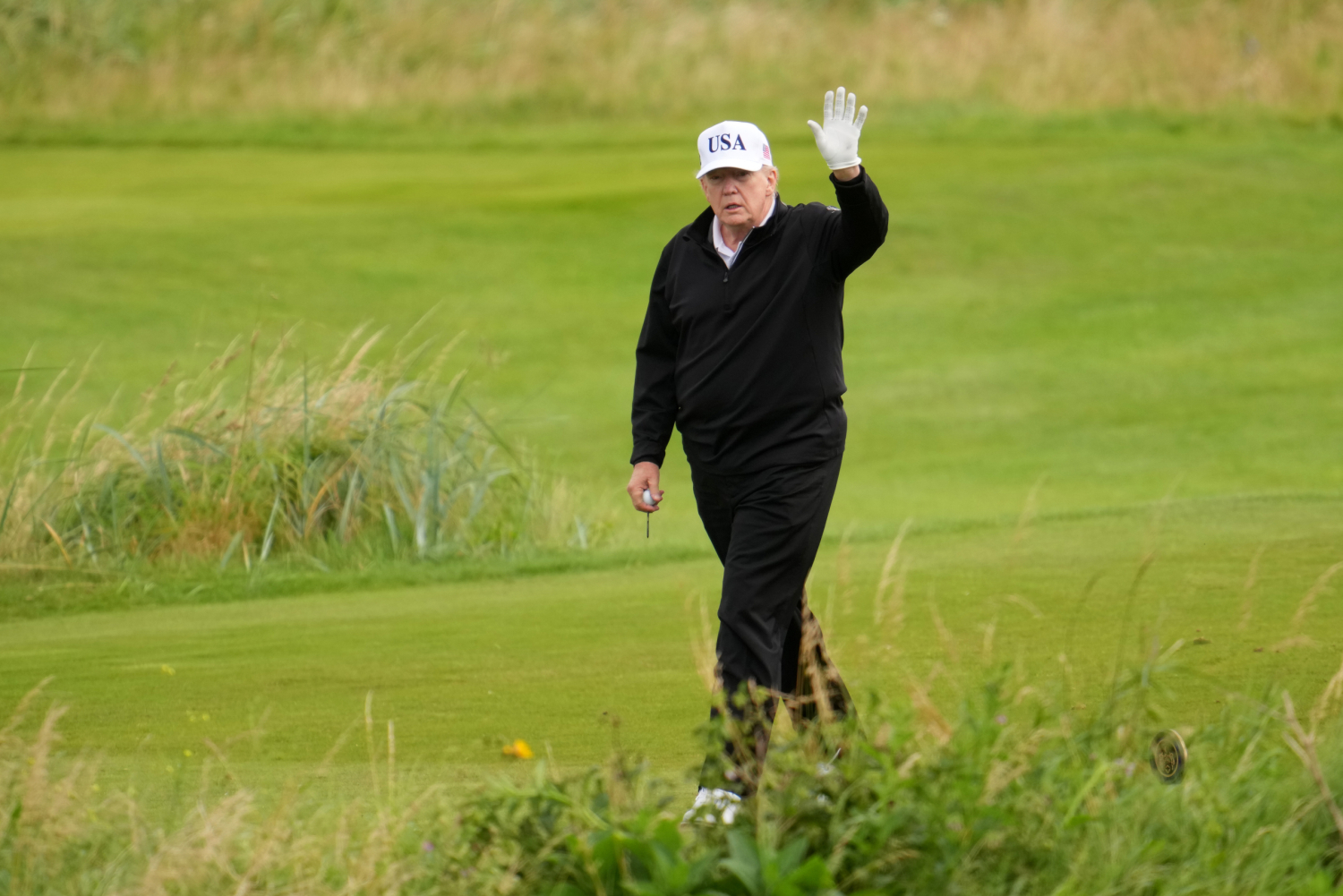 Trump plays golf in Scotland while protesters take to the streets and decry his visit