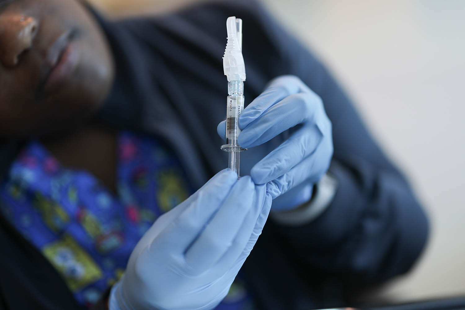 FDA approves updated COVID-19 shots but limits access for some kids and adults