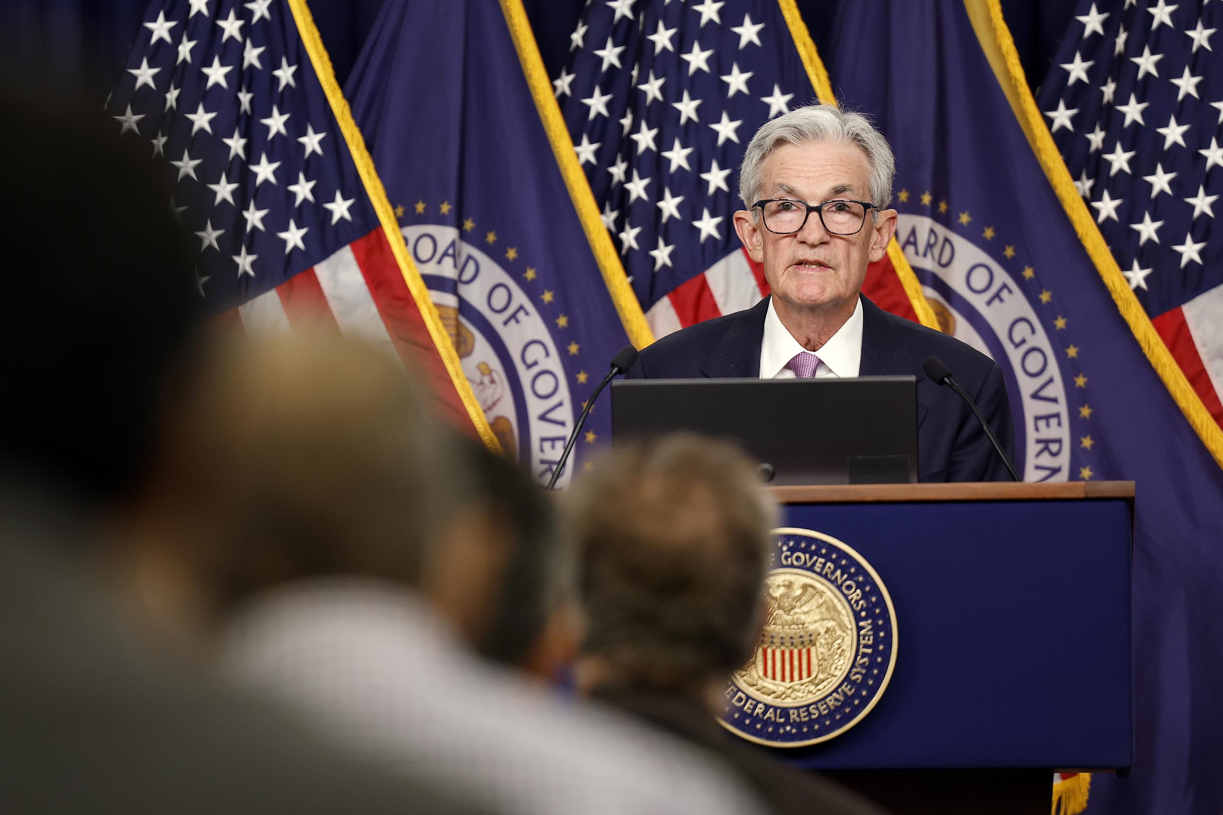 Federal Reserve leaves key rate unchanged as it sees risk of higher prices and higher unemployment
