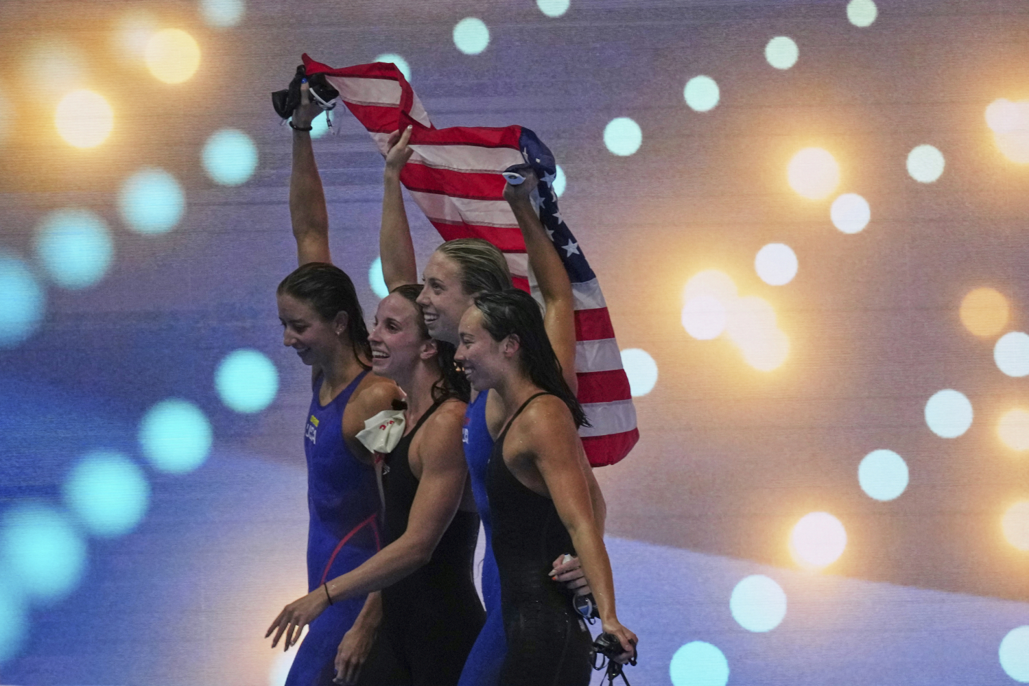 Americans finish strong with a relay world record in the swim worlds to top medal tables