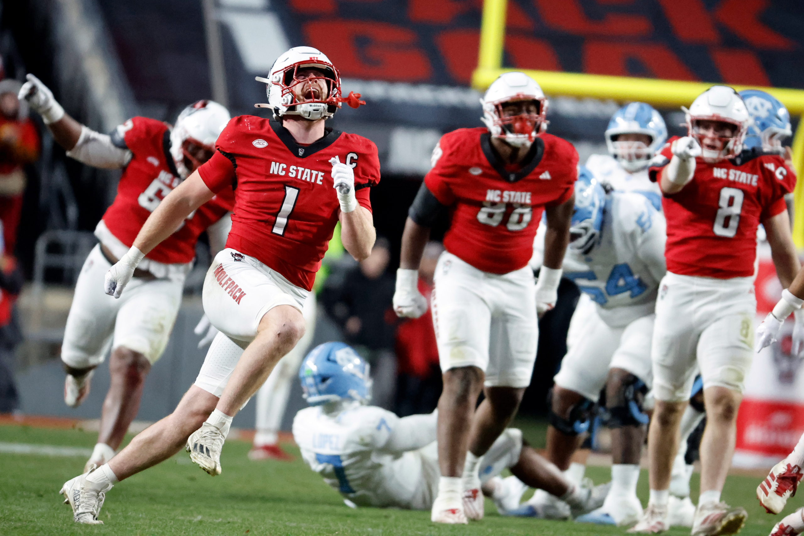 Wilson runs for 4 TDs as NC State beats UNC 42-19, winning rivalry game for 5th straight year