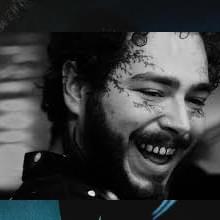 A post delivered kiss!Post Malone kisses a fan on the lips!