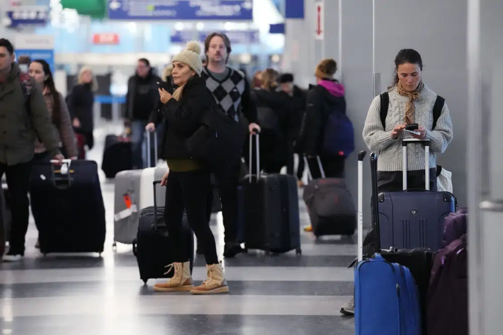 Holiday travel upended as forecasters warn of ‘bomb cyclone’