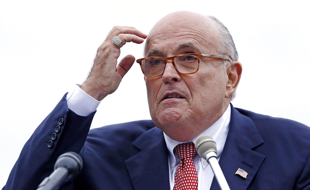 Woman sues Rudy Giuliani, saying he coerced her into sex, owes her $2 million in unpaid wages