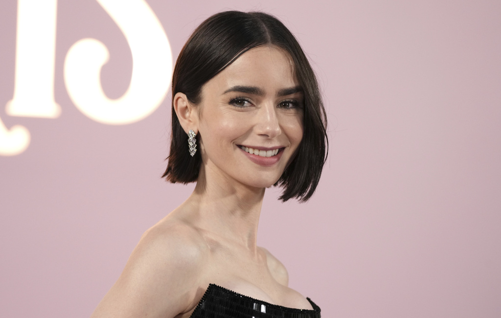 Lily Collins Intros Baby to Phil Collins