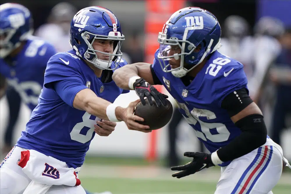 AP source: Giants give Jones 4-year, $160M deal, tag Barkley