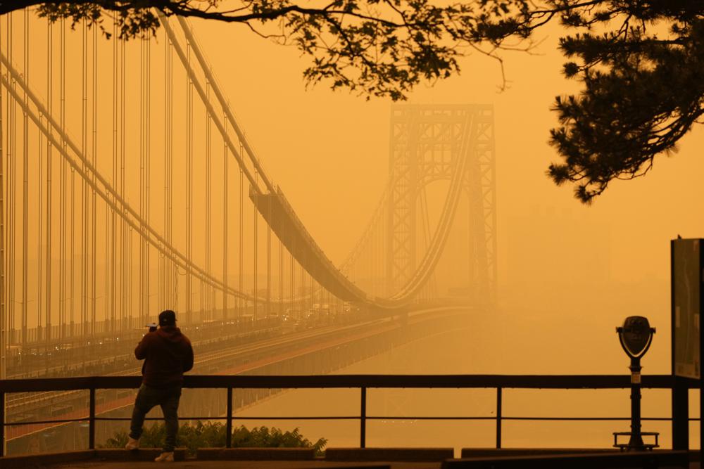 ‘I can taste the air’: Canadian wildfire smoke spreads hazardous haze at home and in the US