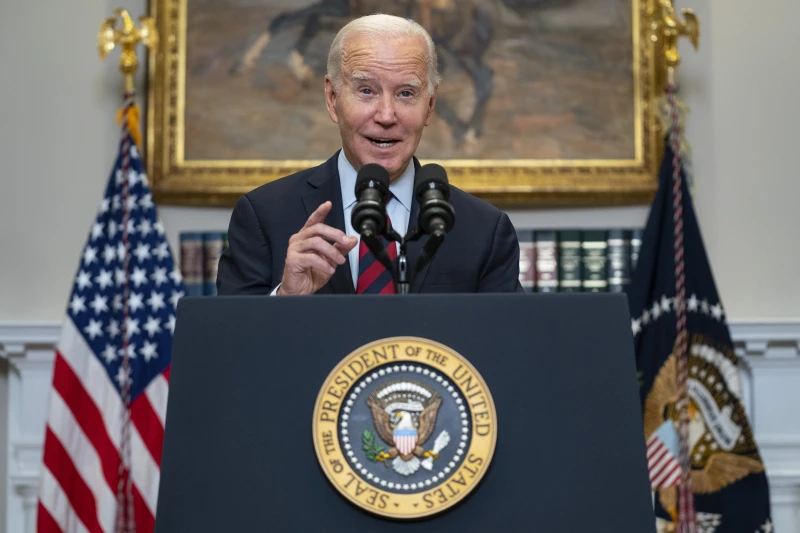 Biden says too many Americans are saddled with school debt as he cancels federal loans for 153,000