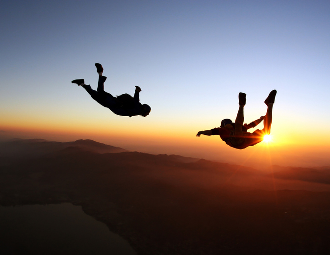 TELL ME SOMETHING GOOD: Sky diver’s parachutes get tangled in mid-air, hug their way to safety