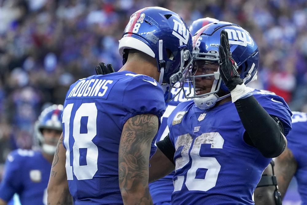 Jones, Barkley lead Giants past Texans 24-16 for 7-2 start