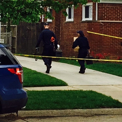 Investigation underway of body of police officer and another man in Dearborn Heights Garage