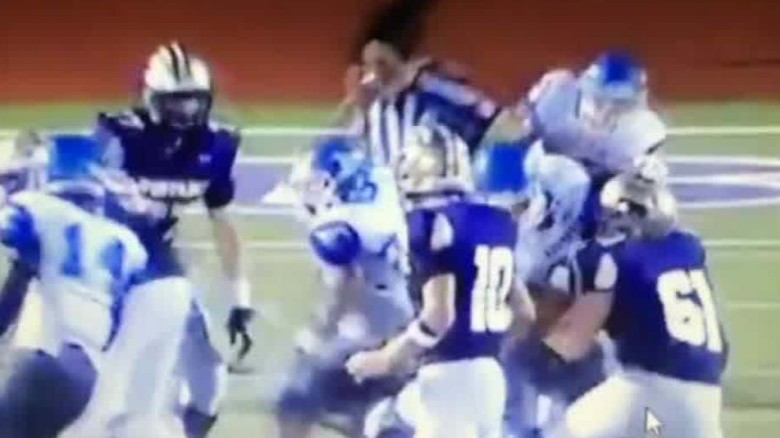Official plans legal action against Texas football players seen hitting him in viral video