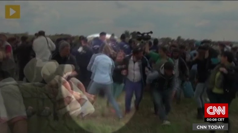 Video: Hungarian camerawoman kicks, trips refugees