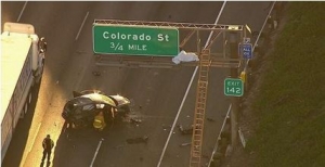 Passenger in car ejected onto Freeway sign in California