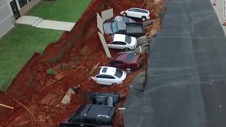 Video: parking lot rips open, 15 cars fall through