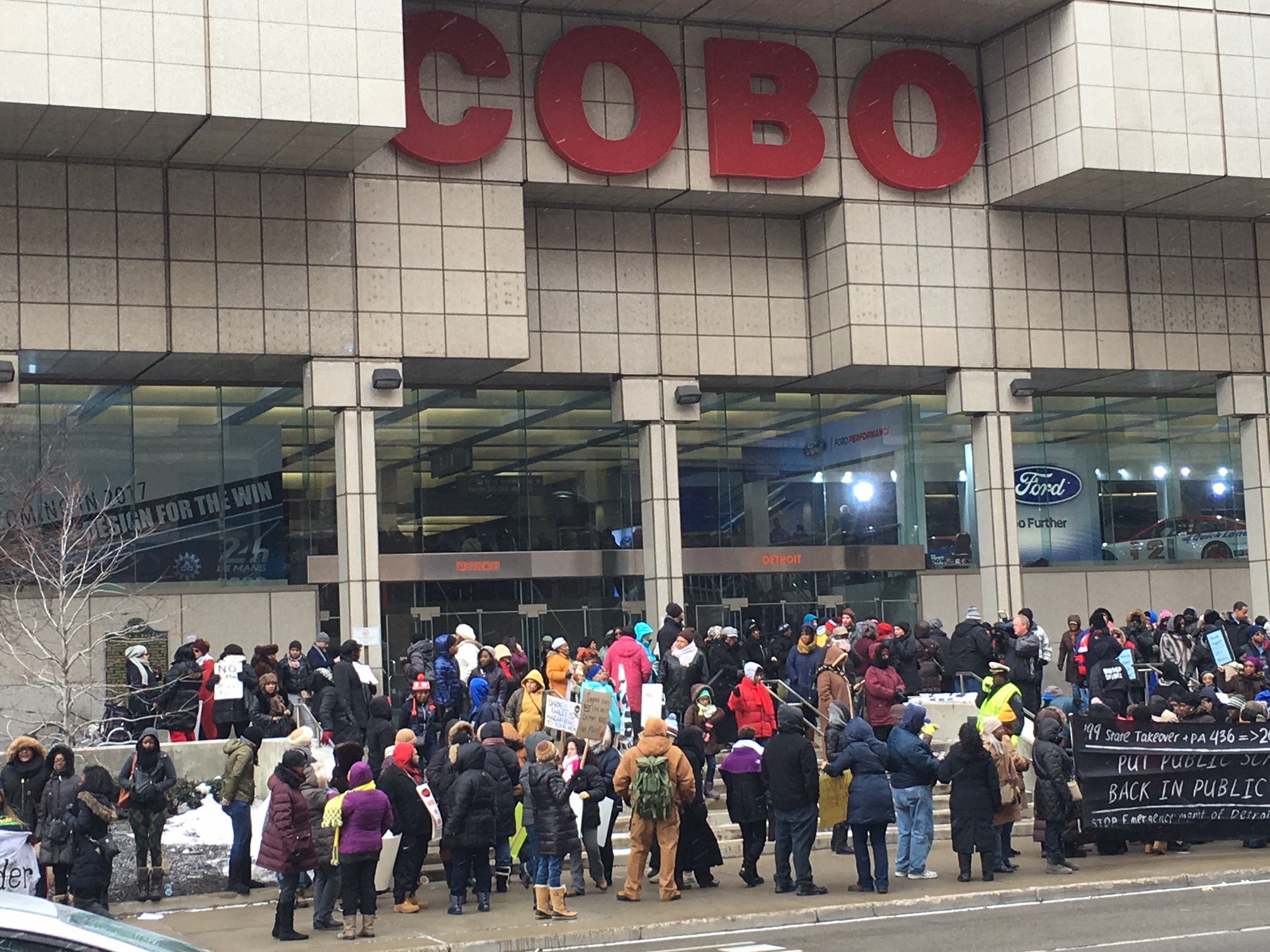 Teacher protest outside Cobo as NAIAS awaits Obama