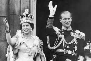 June 2, 1953 ~ Queen Elizabeth II and Prince Philip, Duke of Edinburgh wave from Buckingham Palace on the day of the Queen's coronation. Photo: Keystone / Stringer via Getty