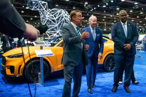 William Clay Ford Jr., Executive Chairman of Ford, left, talks with President Joe Biden and UAW President Ray Curry during a tour of the show floor during the 2022 North American International Auto Show. Photo: Sarahbeth Maney / USA TODAY NETWORK