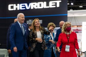 President Joe Biden is given a tour by General Motors CEO Mary Barra flanked by local officials at the 2022 North American International Auto Show