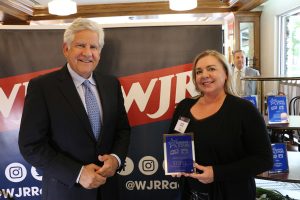 September 27, 2022 ~ Stifel Branch Manager Michelle Stebbins stands with 760 WJR’s Guy Gordon. Photo: Sean Boeberitz / 760 WJR